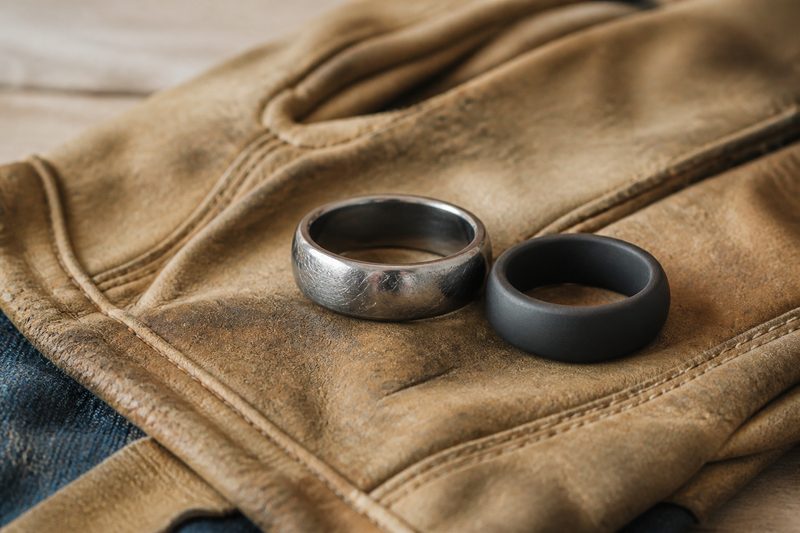 Rugged tungsten ring and backup silicone ring on a leather work glove